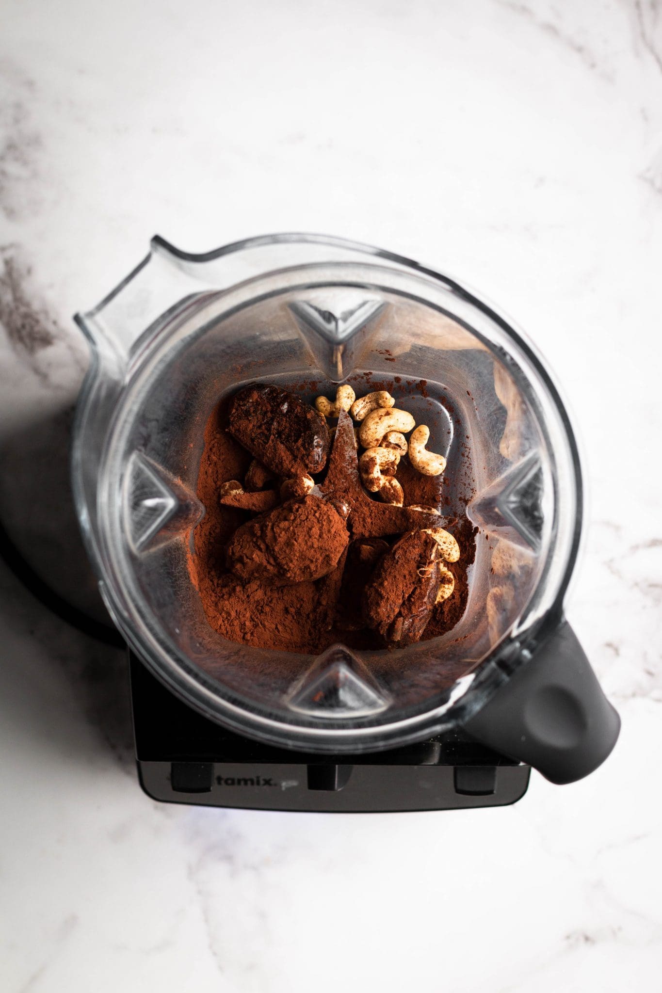 dates, cocoa and cashews in a blender