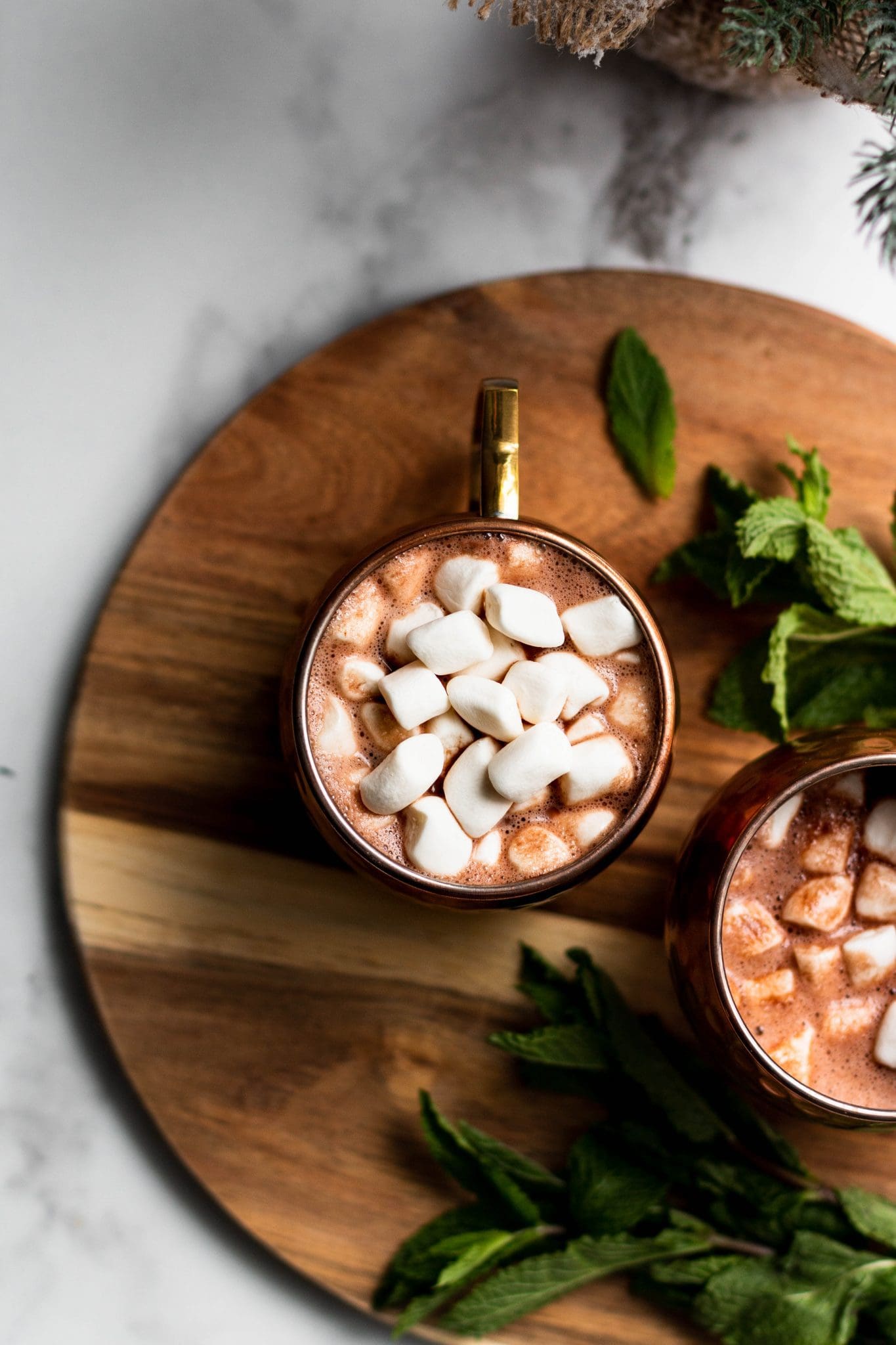 2 cups of peppermint hot cocoa with marshmallows seen from the top