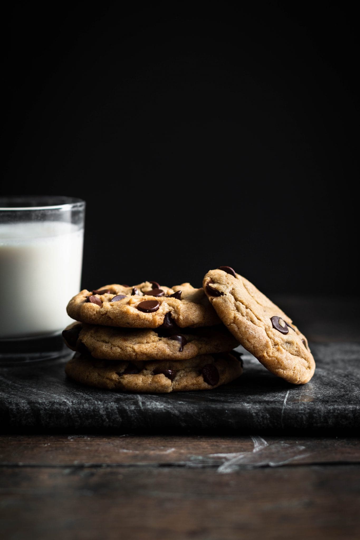 stack of cookies with a glass of milk