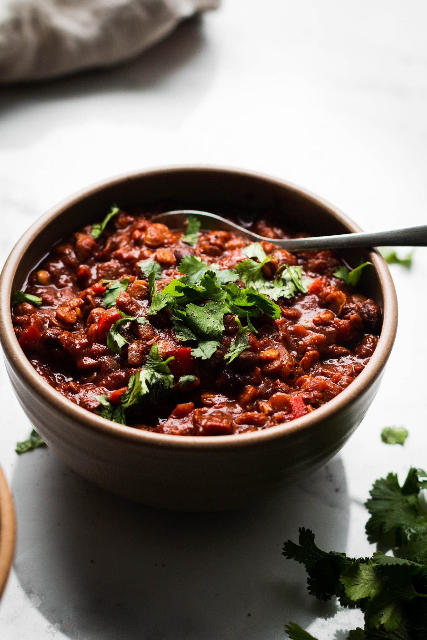 vegetarian chili in a bowl with cilantro