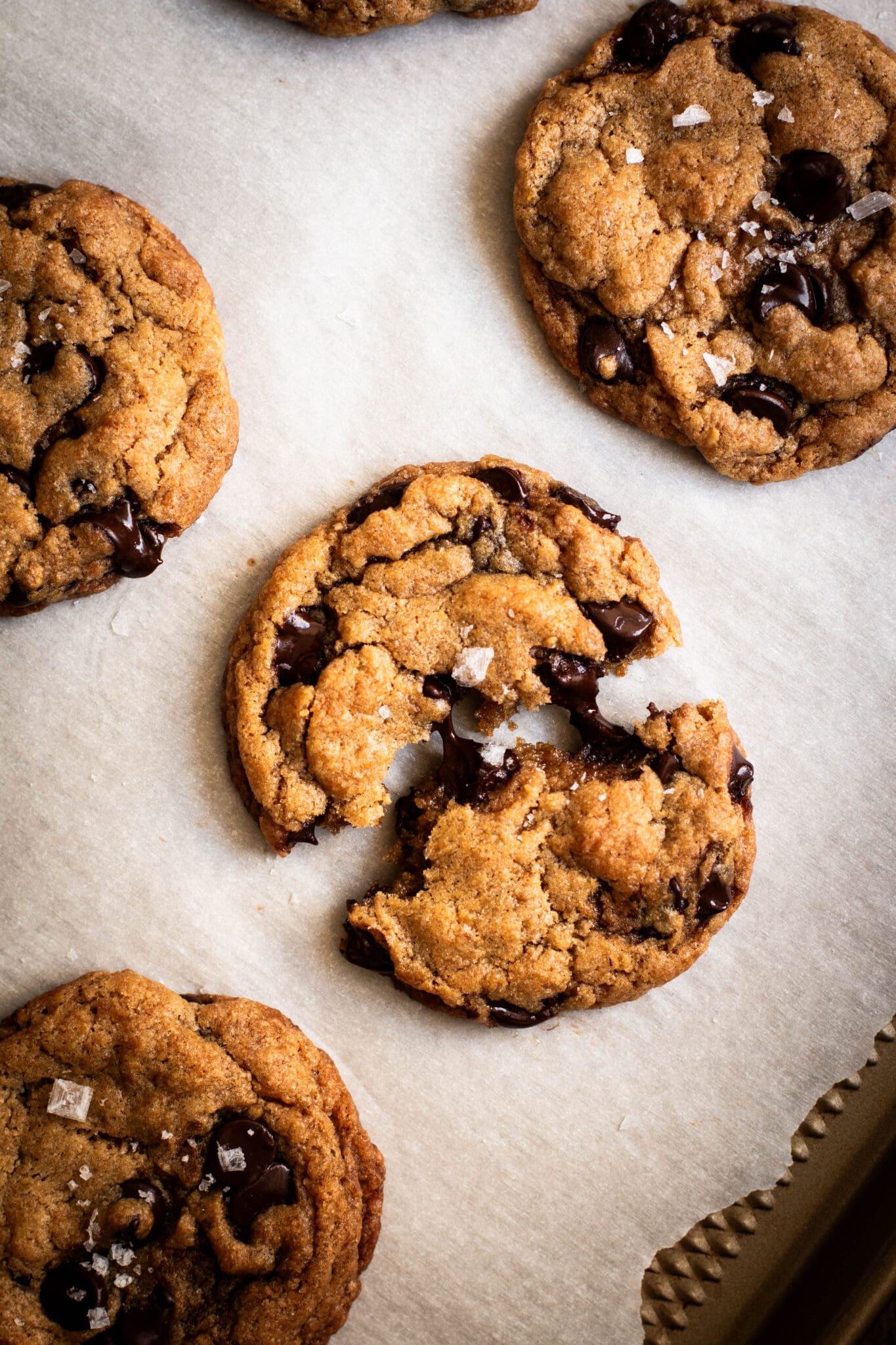 chocolate chip cookie cut in half with melted chocolate