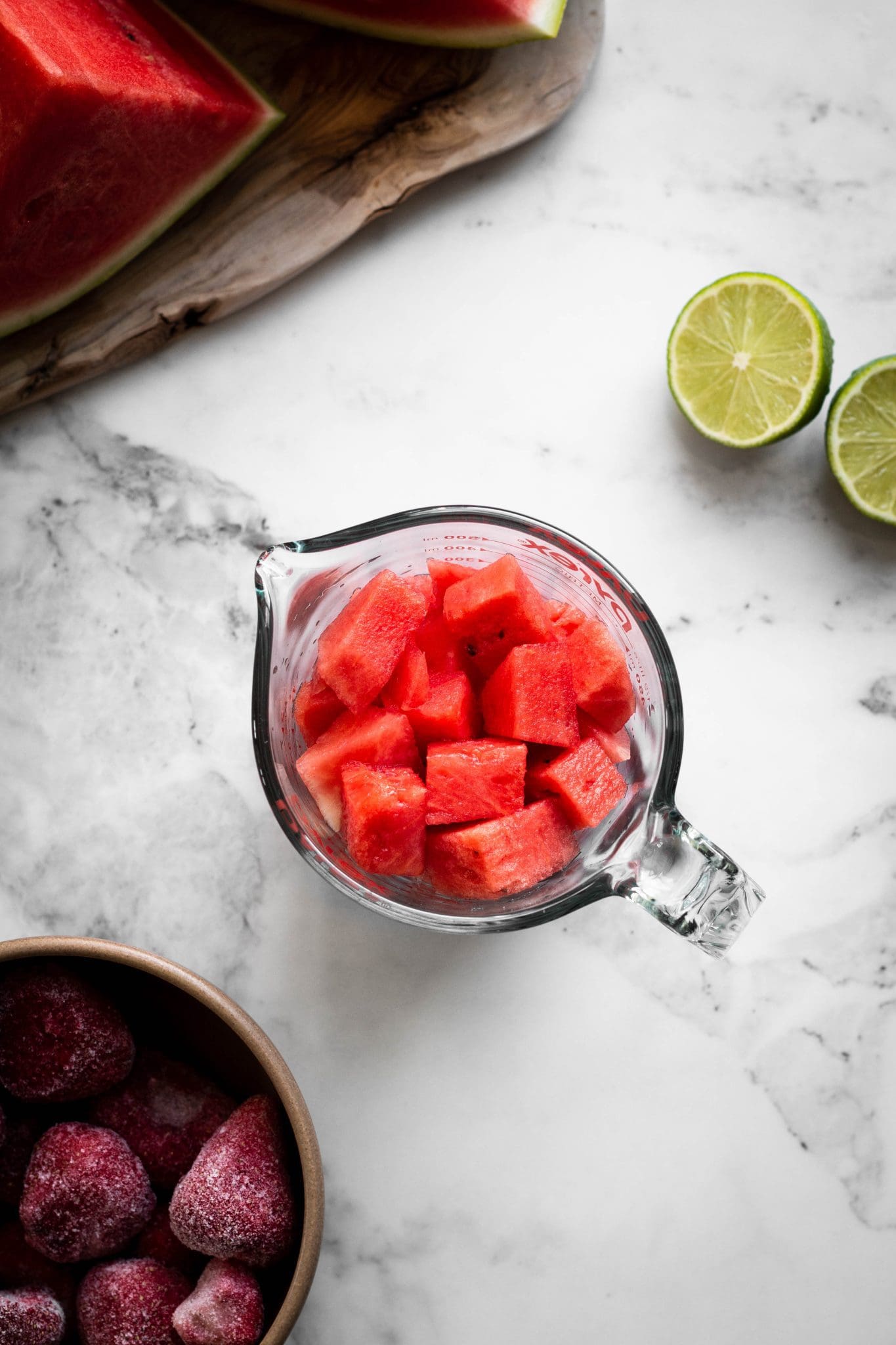 diced watermelon in a measuring cup seen from the top