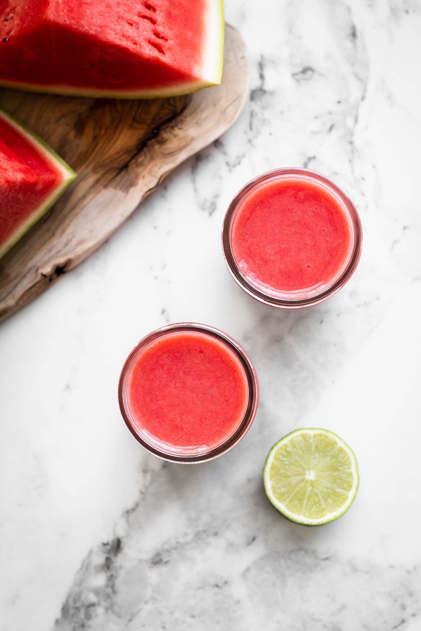 watermelon strawberry lime smoothie in two glasses seen from the top