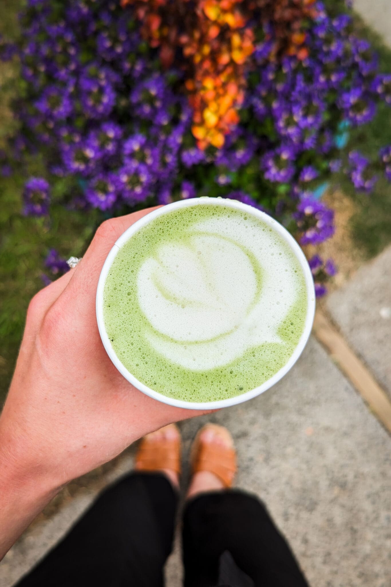 hand holding a matcha latte