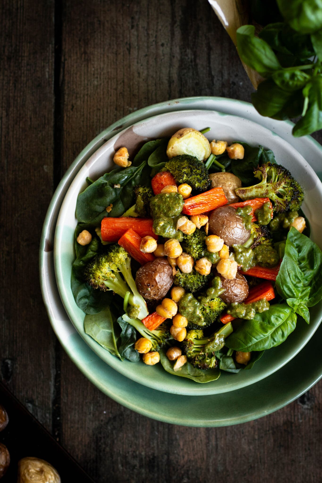 roasted vegetable bowl with almond pesto seen from the top