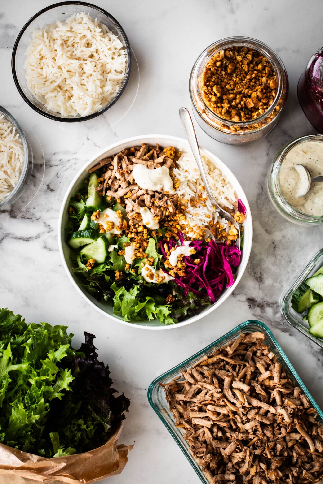 Meal prep salad with ingredients on the side.