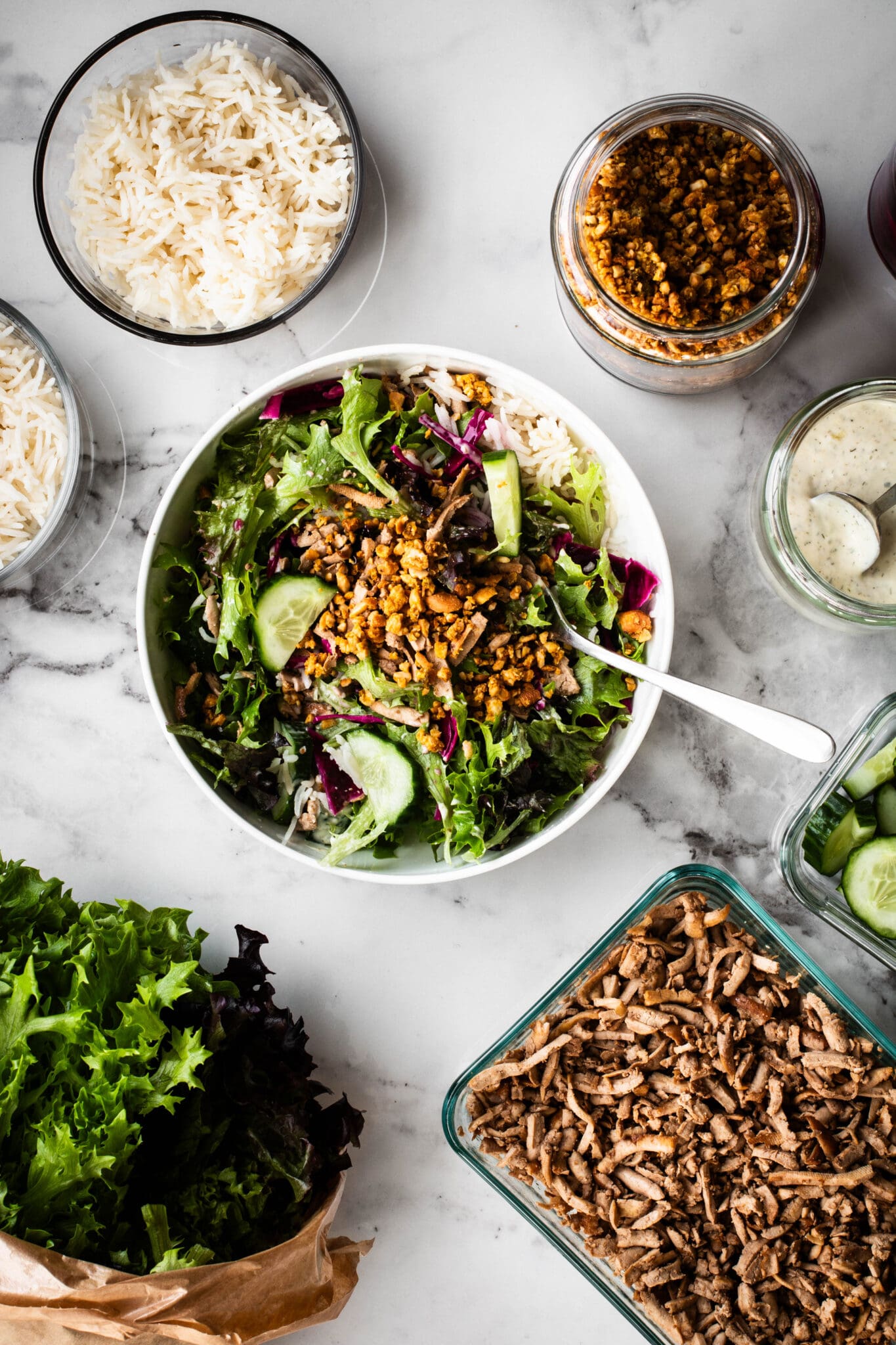 Meal prep salad with ingredients on the side.