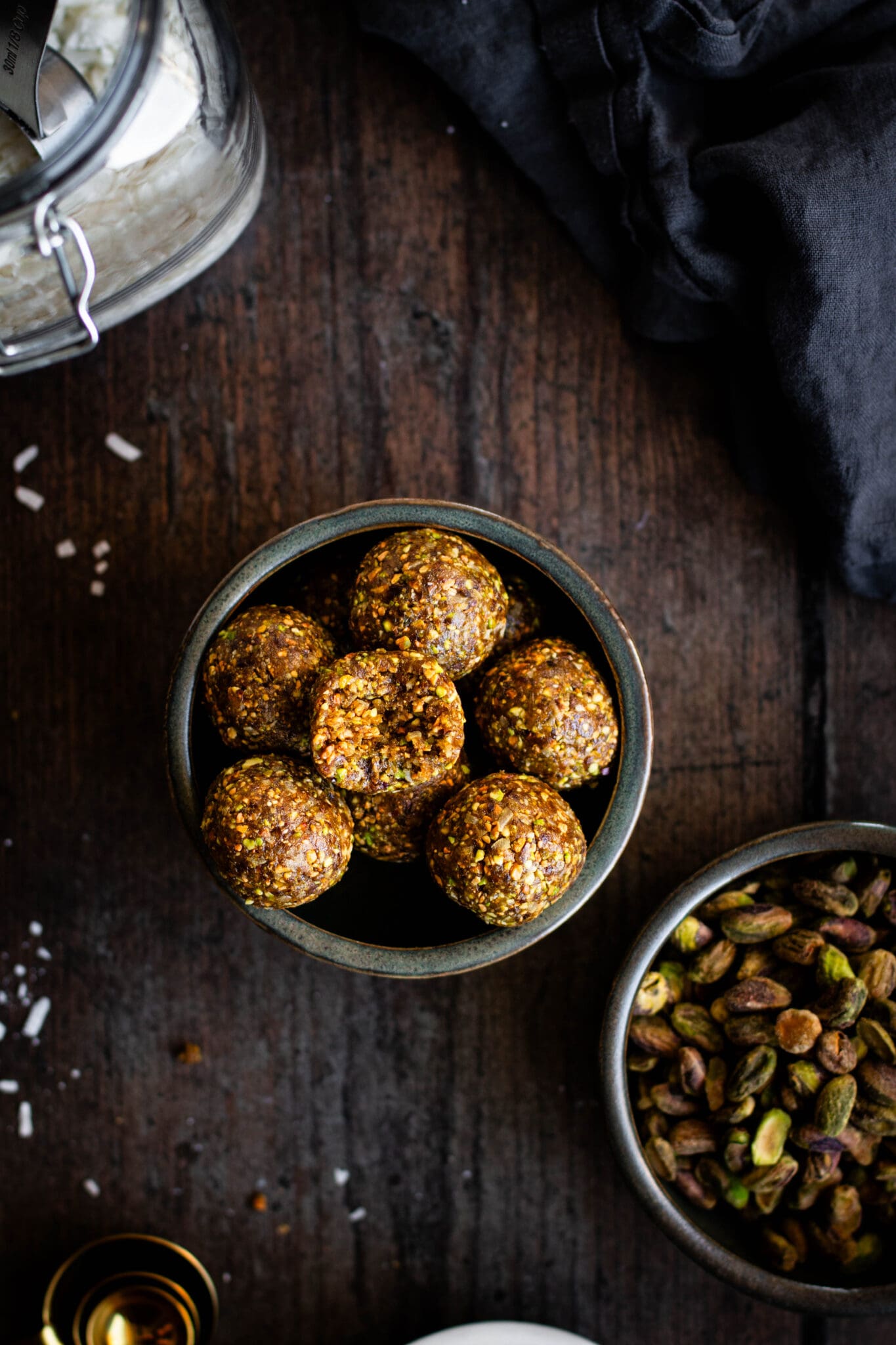 Pistachio energy bites in a bowl seen from the top.