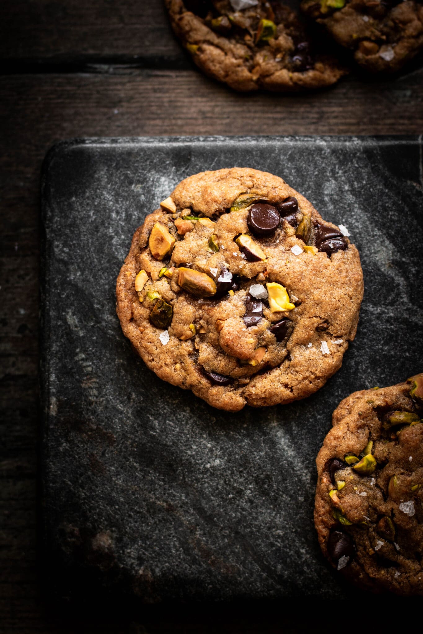 Salted pistachio chocolate chip cookies seen from the top.