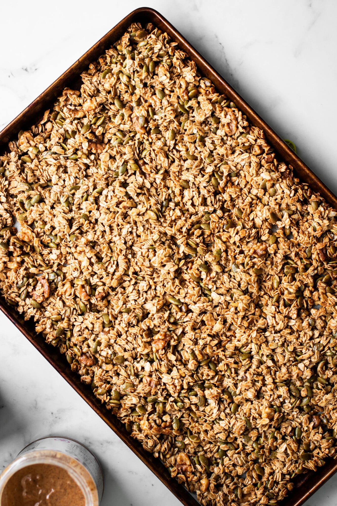 Weekly meal prep granola on a baking sheet