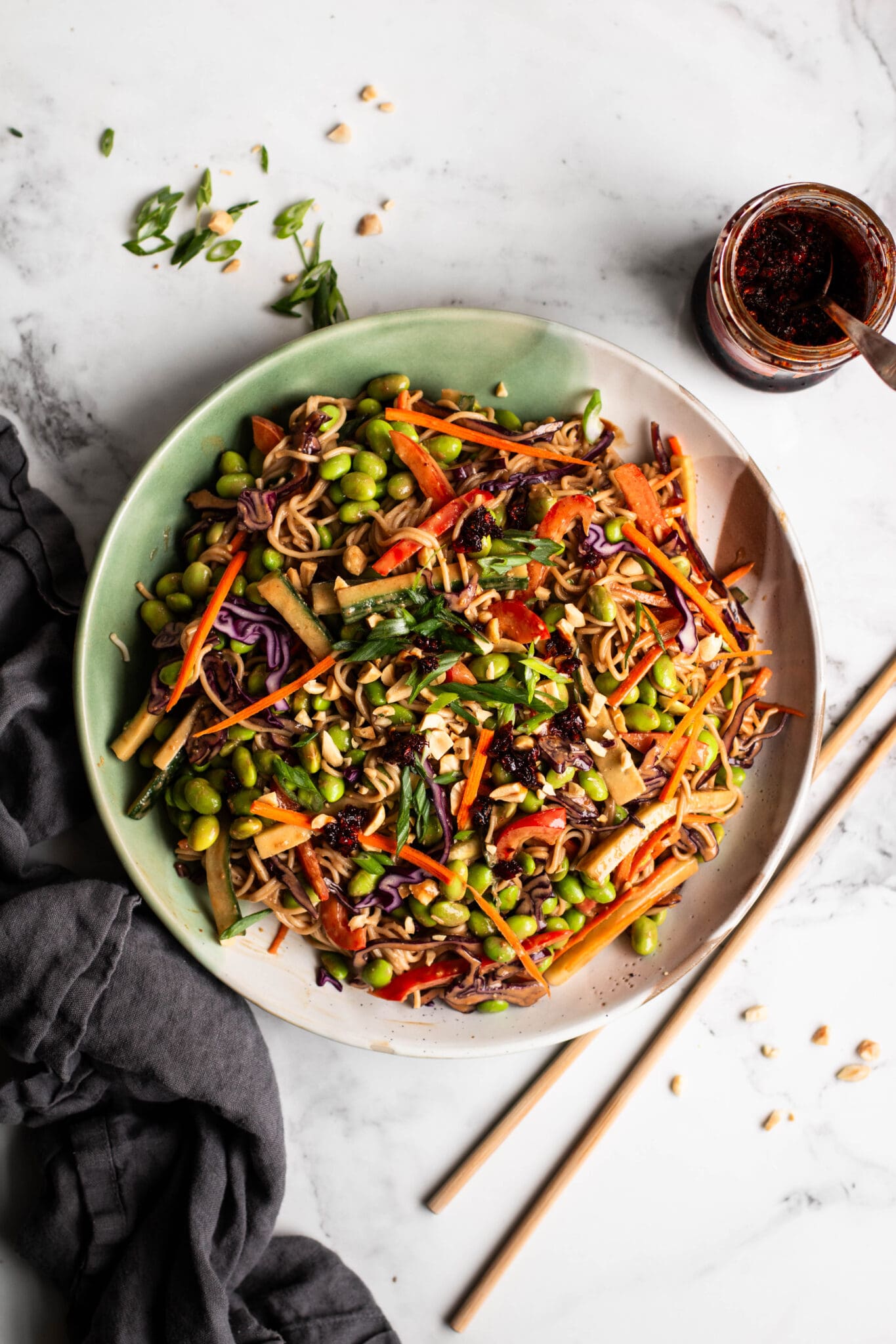 Peanut noodle salad in a large bowl seen from the top.